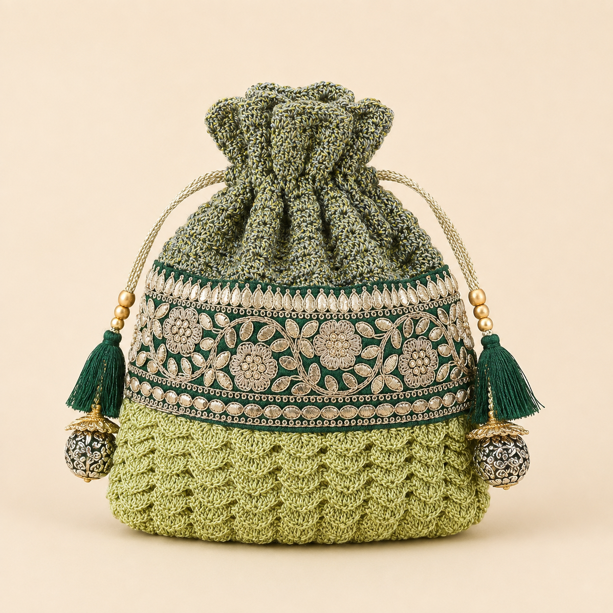 Front view of sage crochet potli with floral embroidery
