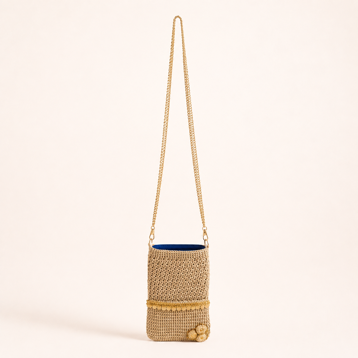 Natural crochet phone sling with gold coin trim and long gold chain strap